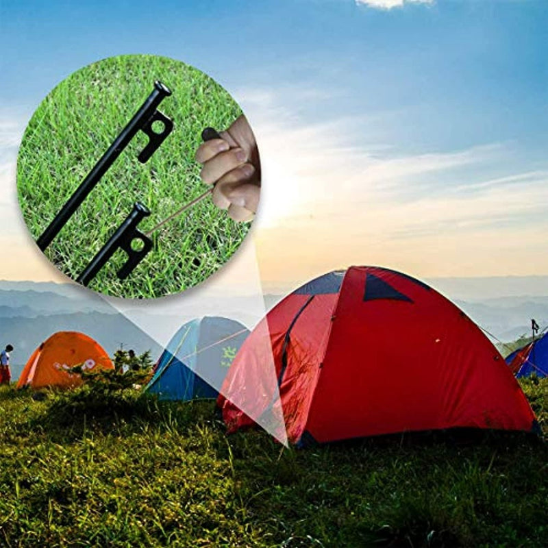 Laad afbeelding in Galerijviewer, Een uitvergrote weergave van T-haak veertrekkers langs een schilderachtige camping met meerdere kleurrijke tenten tegen een zonsopgang, met een nabijgelegen trampoline.
