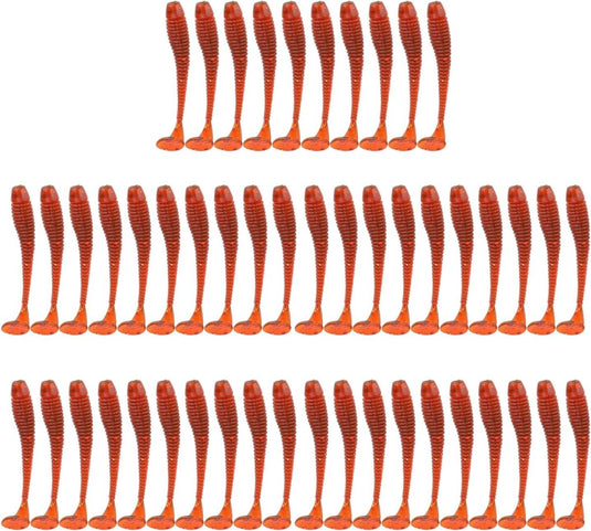 Meerdere rijen oranje gedraaide touwen gemaakt van Vis als een pro met dit 50-delige set zachte kunstaas gerangschikt op een witte achtergrond.