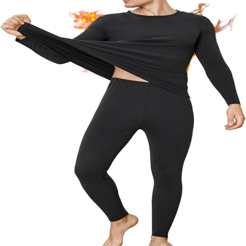 Laad afbeelding in Galerijviewer, Vrouw die de hoge elasticiteit van een zwart thermo-ondergoedtopje met lange mouwen demonstreert.
