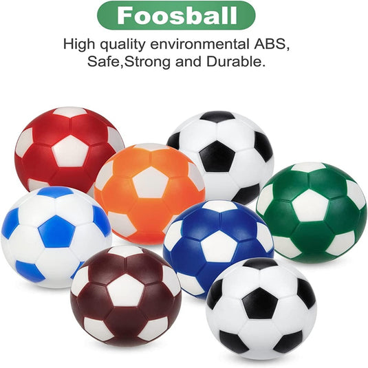 Een collectie van negen kleurrijke professionele tafelvoetbalballetjes in rood, oranje, blauw, groen en traditionele zwart-wit patronen, herhaaldelijk tegen een witte achtergrond.