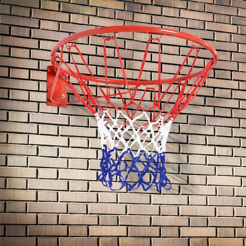 Load image into Gallery viewer, Een basketbalring met een rood, wit en blauw Basketbalnet voor thuis en buiten: Speelplezier voor groot en klein, gemaakt van weerbestendig nylon, gemonteerd op een bakstenen muur.
