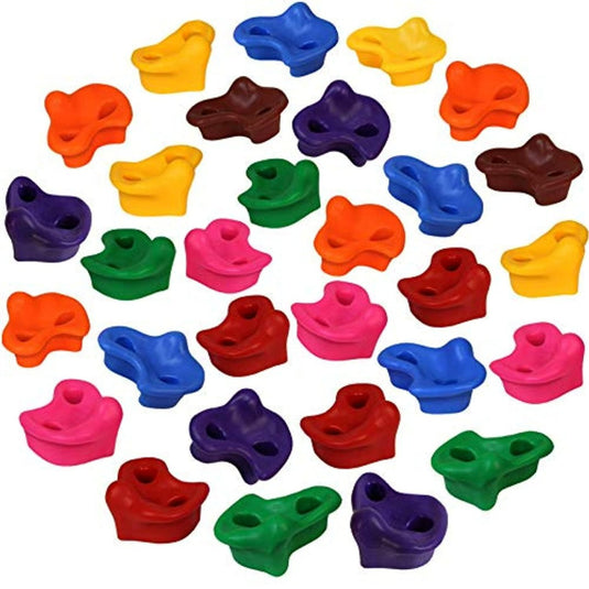 Een groep kleurrijke plastic vormen, bekend als klimgrepen, gerangschikt in een cirkelvormige formatie. Deze veelzijdige klimgrepen kunnen zowel binnen als buiten gebruikt worden bij klimactiviteiten.