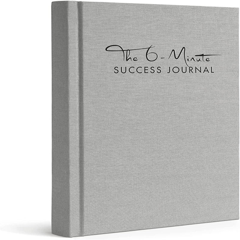 Laad afbeelding in Galerijviewer, Een grijs hardcover boek met de titel &quot;Het 6-Minute Success Journal: Transformeer je Leven met Slechts 6 Minuten Per Dag!&quot; rechtopstaand weergegeven met een gestructureerde omslag, ontworpen om de productiviteit te verhogen.
