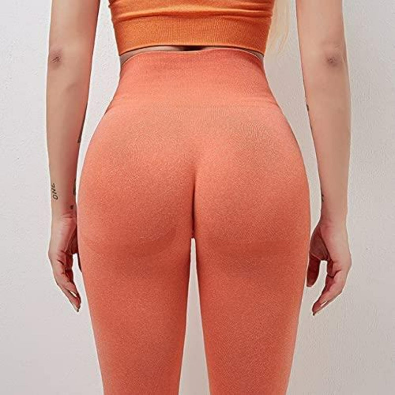 Laad afbeelding in Galerijviewer, Vrouw draagt oranje ingedeelde Ontdek de perfecte balans van stijl en comfort met onze yogaleggings voor dames!
